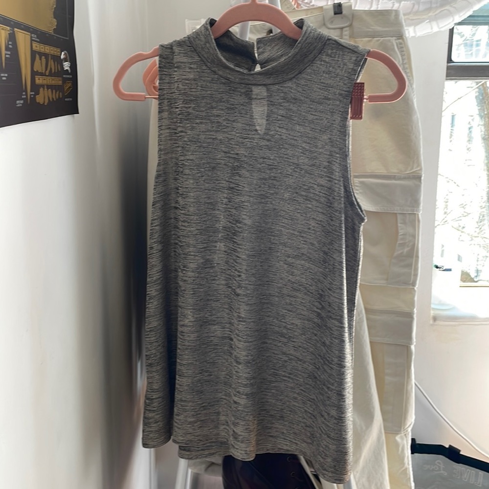 Semi sheer sleeveless turtleneck